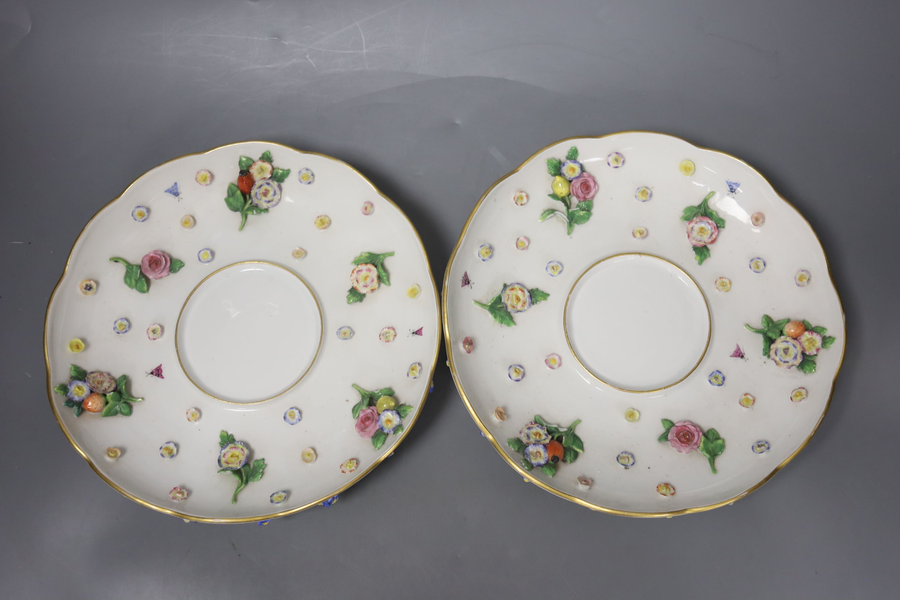 A pair of 19th century Meissen two handled ecuelles and covers, stands width 21cm